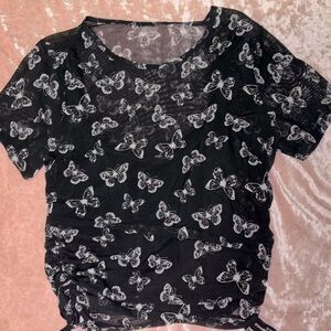 Cropped, see through butterfly shirt with attached tank top underneath.